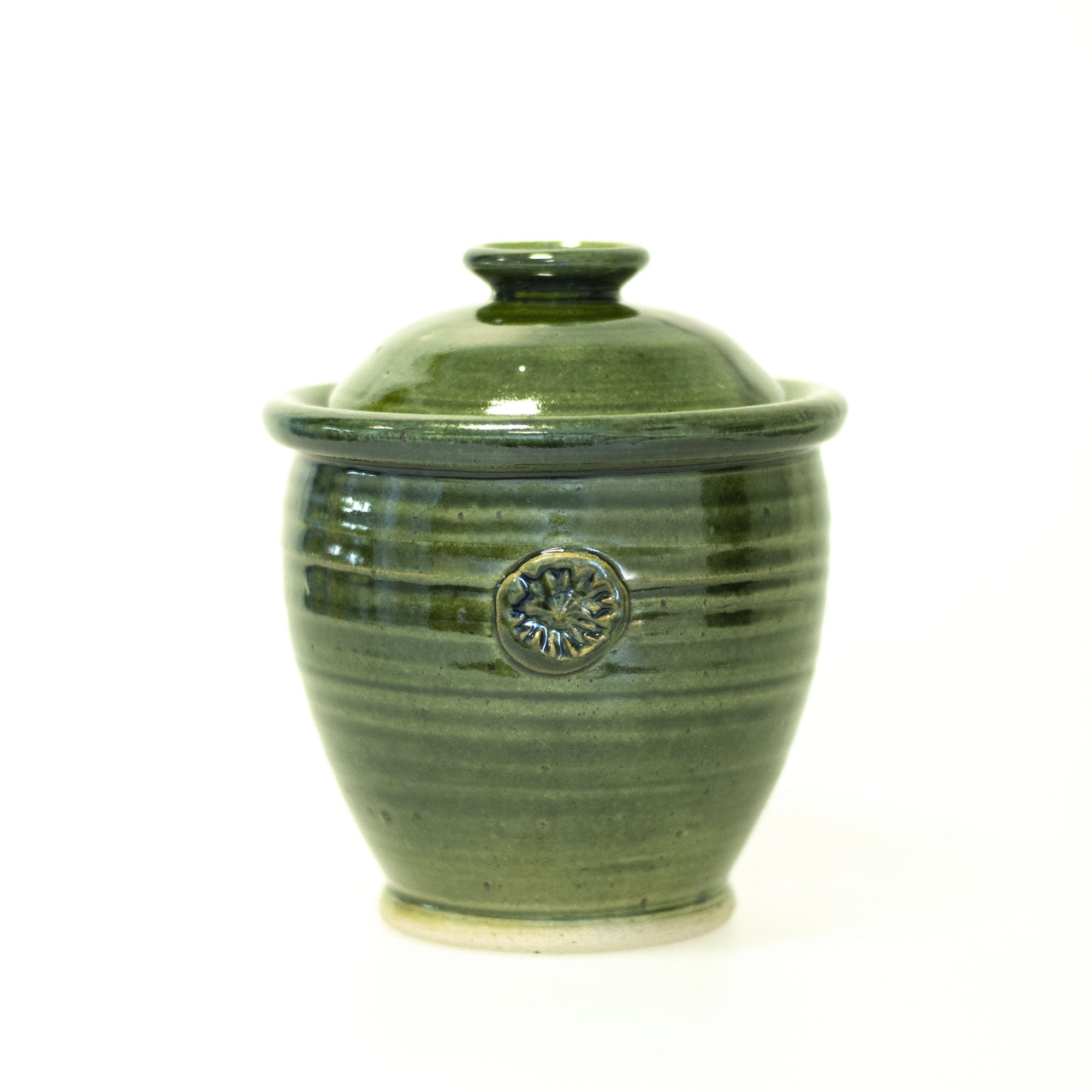 Avtryck - handdrejad burk med lock i keramik. Grön glasyr